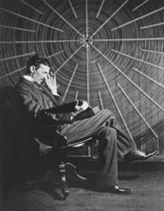 Tesla sitting with his Giant Pancake Coil