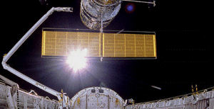 the Sun at 320 miles altitude, during Hubble placement, looking out of shuttle bay..