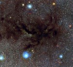 Filaments of dust obscure starlight near the center of the Milky Way. Credit: ESO