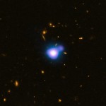 X-ray jet from a quasar said to be over 12 billion light-years away. Credit: X-ray: NASA/CXC/NRC/C.Cheung et al; Optical: NASA/STScI; Radio: NSF/NRAO/VLA