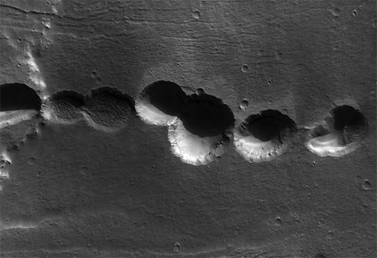 A chain of electrically etched craters in the Alba Terra region of Mars
