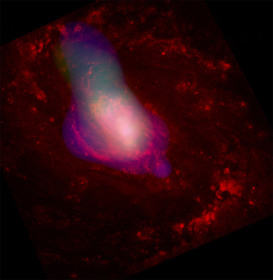 Galaxy NGC 1068 reveals a powerful stream of X-rays emerging from its nucleus. Credit: X-ray: NASA/CXC/MIT/UCSB/P.Ogle et al.; Optical: NASA/STScI/A.Capetti et al.