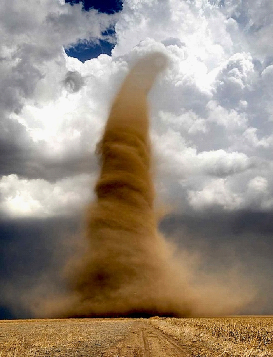 Exceptionally large dust devil in Kansas known as a land spout. Credit: Jim Reed.