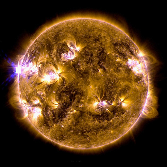 An X1.7-class solar flare on May 12, 2013 (bright point on the left of the Sun) from NASA's Solar Dynamics Observatory (SDO). This image is a blend of two images: one recorded in the 171 angstrom wavelength, the other in 131 angstroms. Credit: NASA/SDO/AIA