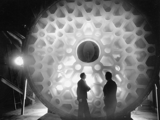 Inspecting the 5.08 meter, 17 ton Hale telescope Pyrex mirror installed in the Mt. Palomar Observatory, California in 1948. Credit: Corning Glass Works