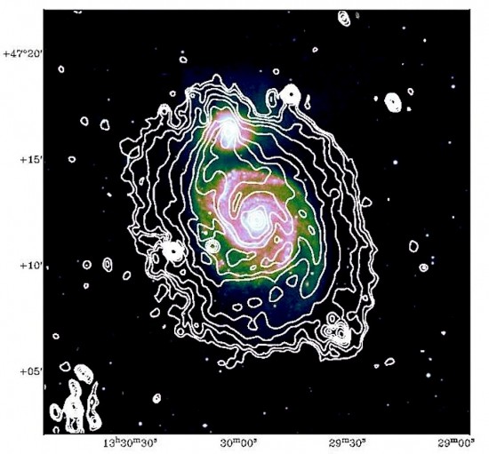 Spiral galaxy M51 and its companion M51b in radio frequencies (white). Credit: David Mulcahy et al., Astronomy & Astrophysics, Max-Planck-Institut für Radioastronomie