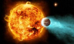 A star with a planet in very close orbit around it, about 880 light years from Earth.